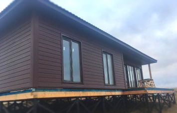 Дом с фасадной отделкой DECOVER