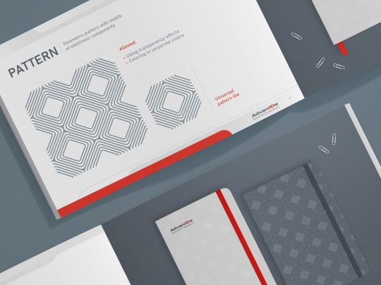 Brand guidelines for a tech company — open brand book showcasing corporate color palette, typography, and key visual identity elements